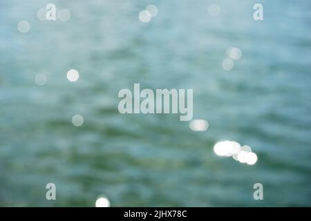 Sun reflecting in water surface - bokeh effect Stock Photo