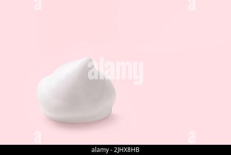 White cosmetic foam mousse, cleanser, shaving foam, washing product, shampoo on pink background. Stock Photo