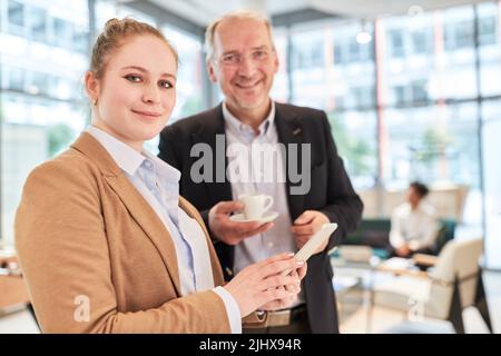 Young businesswoman with tablet computer as IT security officer in the office Stock Photo