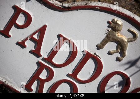 Village of Eccleston, England. Picturesque close up view of an Eaton Estate road name plaque (Paddock Road) on Paddock Road. Stock Photo