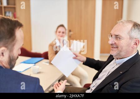 Two business people as managers or business partners are discussing in a meeting Stock Photo
