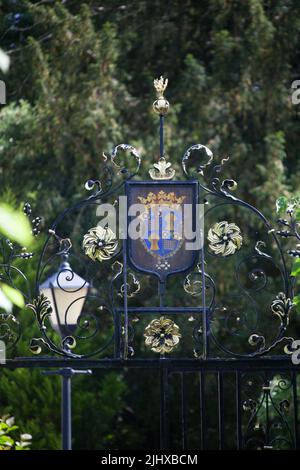 Village of Eccleston, England. Picturesque close up view of the St Mary’s Church wrought iron church gates overthrow. Stock Photo