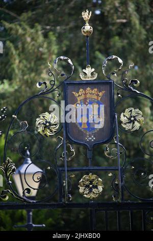 Village of Eccleston, England. Picturesque close up view of the St Mary’s Church wrought iron church gates overthrow. Stock Photo