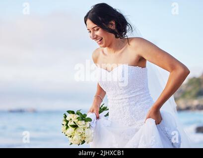 Ive been dreaming about this day. a beautiful woman on the beach on her wedding day. Stock Photo