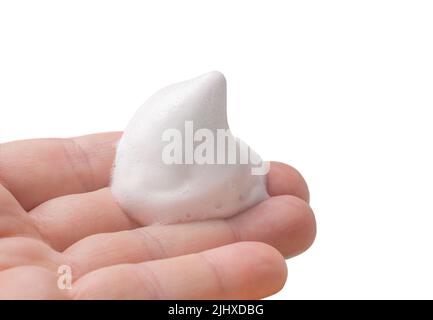 Hand holding shaving foam isolated on white. Stock Photo