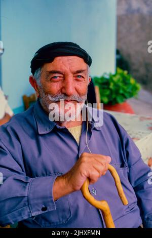 Old Greek man with walking stick, Crete, Greece. Stock Photo