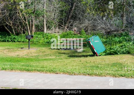 Animal proof trash receptacle in public park Stock Photo