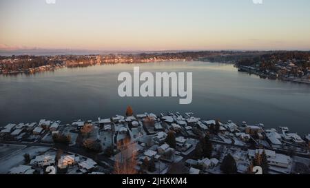 An aerial drone view of the eastside of Lake Stevens at sunset in winter Stock Photo