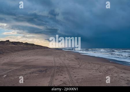 Dark skies at the north sea in Denmark. High quality photo Stock Photo