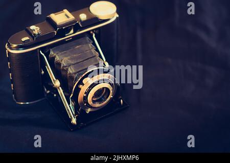 Vintage analog medium format film camera close up view. Vintage film camera with bellows. Stock Photo
