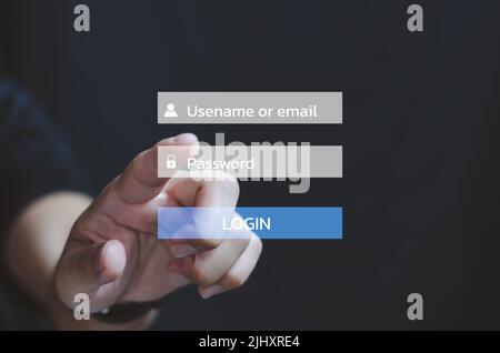 Businessman touching on virtual screen Password Usename or email login account online. Stock Photo