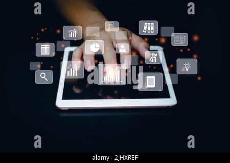 Business man use tablet for big data analysis and business intelligence marketing planning concept virtual screen. Stock Photo