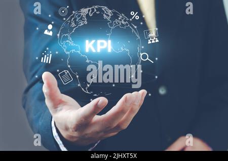 Man hand virtual world icon. KPI icons and symbols Key Performance Indicator virtual screen. Business concept. Stock Photo
