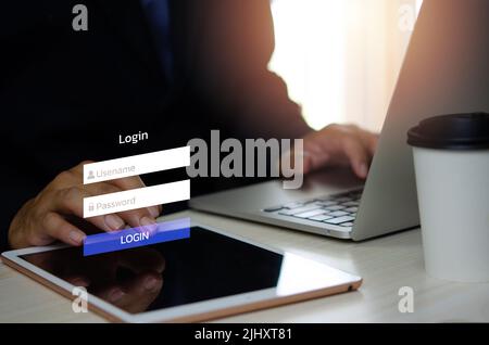 man using login interface on touch screen. user name and password inputs on virtual digital tablet account online. Stock Photo