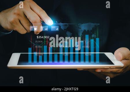Business analysis and economic growth big data with financial graphs. Concepts of digital virtual screen marketing dashboard technology and global eco Stock Photo