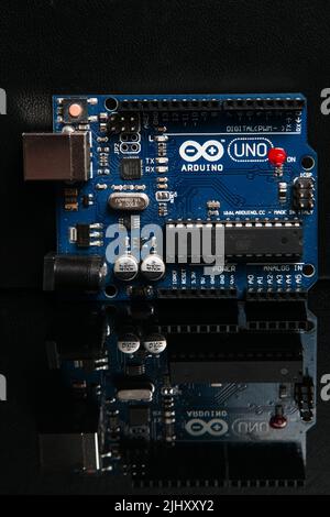 Arduino UNO board on black background Stock Photo