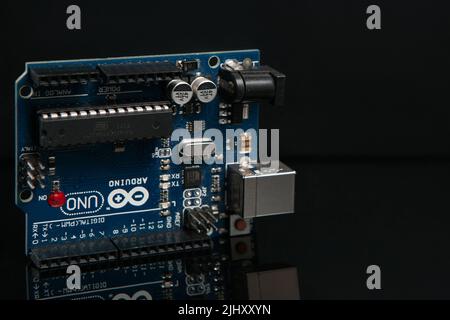 Arduino UNO board on black background Stock Photo