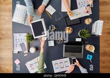 business team with gadgets working at office table Stock Photo