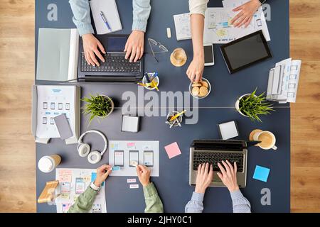 business team with gadgets working at office table Stock Photo