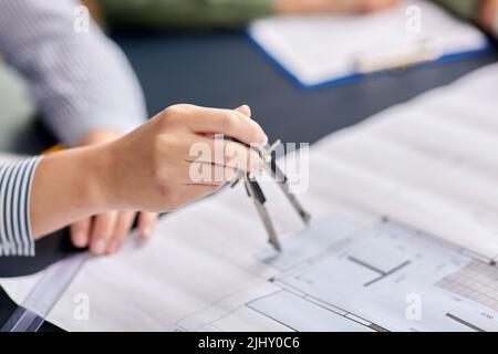 architect with blueprint and drafting compass Stock Photo