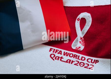 QATAR, DOHA, 18 JULY, 2022: France National flag and logo of FIFA World Cup in Qatar 2022 on red carpet. Soccer sport background, edit space. Qatar 22 Stock Photo