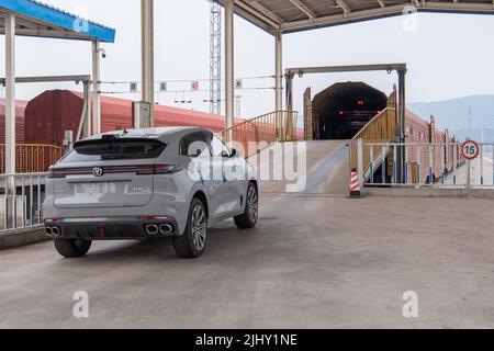 (220721) -- CHONGQING, July 21, 2022 (Xinhua) -- Cars produced by Changan Automobile are loaded onto a JSQ freight vehicle of China Railway Special Cargo Logistics Co., Ltd. at Yuzui Station in southwest China's Chongqing, July 21, 2022. A JSQ freight vehicle of China Railway Special Cargo Logistics Co., Ltd., loaded with 207 cars manufactured by Changan Automobile, left Yuzui Station in southwest China's Chongqing on Thursday for its first pilot run to Moscow, Russia. Shipping time from Chongqing to Moscow will be reduced to 18 days using the China-Europe freight train service, compared to Stock Photo