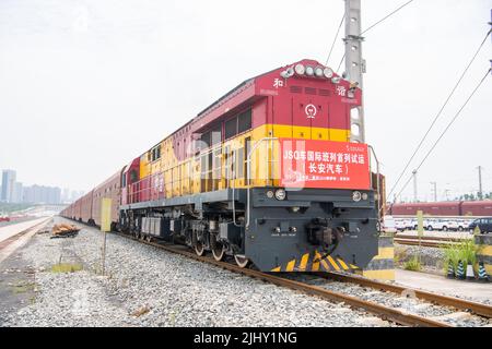 (220721) -- CHONGQING, July 21, 2022 (Xinhua) -- A JSQ freight vehicle of China Railway Special Cargo Logistics Co., Ltd. is about to leave Yuzui Station in southwest China's Chongqing, July 21, 2022. A JSQ freight vehicle of China Railway Special Cargo Logistics Co., Ltd., loaded with 207 cars manufactured by Changan Automobile, left Yuzui Station in southwest China's Chongqing on Thursday for its first pilot run to Moscow, Russia. Shipping time from Chongqing to Moscow will be reduced to 18 days using the China-Europe freight train service, compared to 35 days using marine shipping. (Xinh Stock Photo