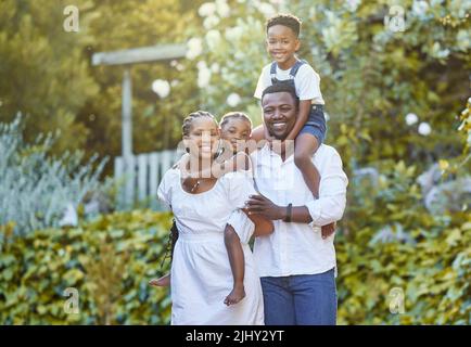 Our love gave us two beautiful kids. a couple spending time outdoors with their two children. Stock Photo