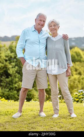 In family life, love is the oil that eases friction. a senior couple standing together outside. Stock Photo
