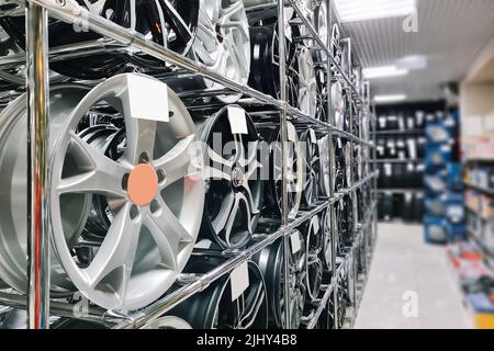 Auto shop selling car rims. Stand for sale of alloy wheels. Discounts ...
