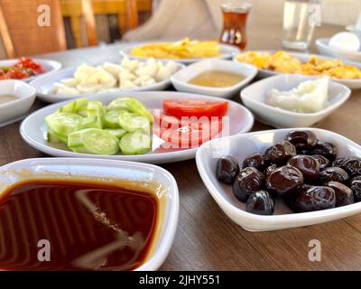 breakfast, traditional spread turkish breakfast on table with variety of food, salad and olive with selective focus. food concept photo Stock Photo