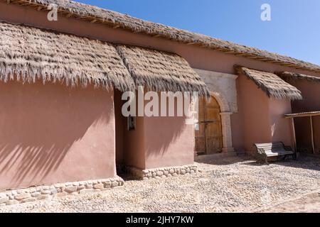 Original stonework on the side portal of the Saint Francis of Assisi Church in Socoroma, Chile. Stock Photo