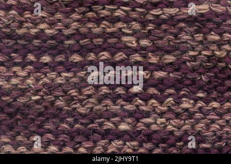 Abstract knitted purple background texture Stock Photo
