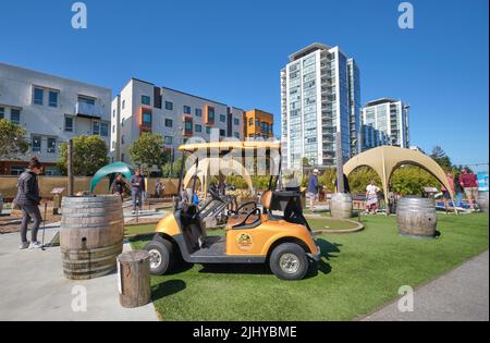 A view of some of the holes and a golf cart. At the Stagecoach Greens miniature golf course in the Mission area of San Francisco, California. Stock Photo