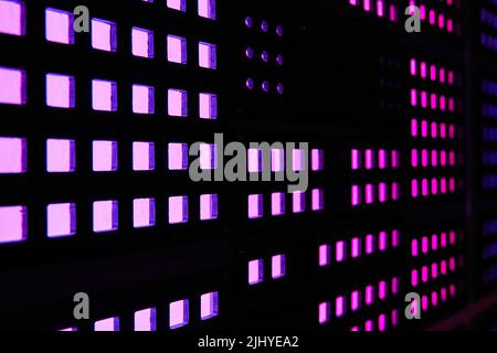 Wall of purple square lights on computer Stock Photo