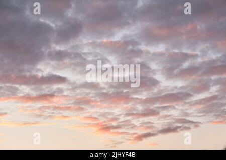 Copy space of altocumulus clouds in a moody sky at twilight. Scenic panoramic of a dramatic cloudscape and thunderous background at sunrise or sunset Stock Photo