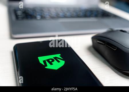 uses VPN application on smartphone. Virtual private network, anonymous, safe and secure internet access on mobile phone. Desktop banner, technology ba Stock Photo