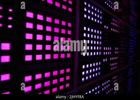 Angle of wall covered in purple square lights Stock Photo