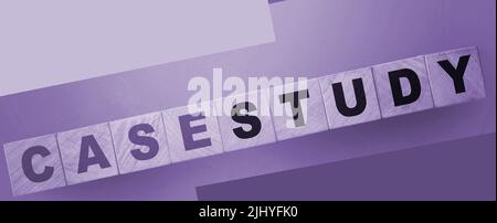 Case Study written on a wooden cubes. Examples in business and education concept Stock Photo