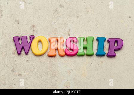 The word Worship written in plastic colorful letters Stock Photo