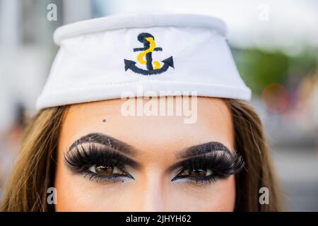Berlin, Germany. 21st July, 2022. Amy Strong wears a sailor cap before the start of a Christopher Street Day (CSD) event on the Spree River. Credit: Christoph Soeder/dpa/Alamy Live News Stock Photo