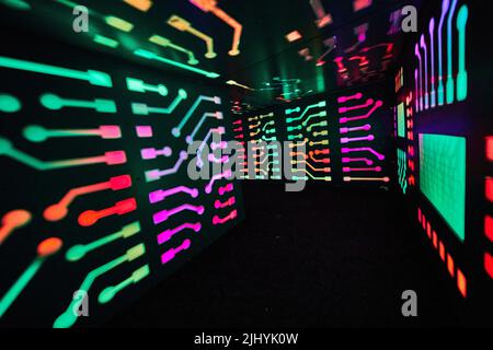 Multi-color computer lights in small tunnel Stock Photo