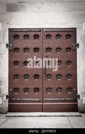 Background with brown solid medieval door Stock Photo