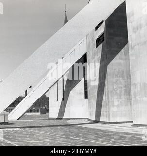 1969, historical, exterior of the Liverpool Metropolitan Cathedral, Liverpool, England, UK. Designed by Sir Frederick Gibberd - in the modern style of the era - and built in concrete with a portland stone cladding, it was opened (consecrated) in 1967. Conical in shape, the cathedral is supported by concrete trusses held together by two ring beams. Stock Photo
