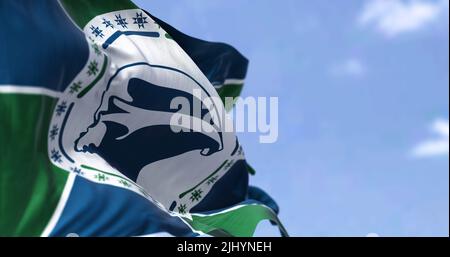 Flag of Martinique waving in the wind on a clear day. Martinique is an island of the Antilles, French overseas department Stock Photo