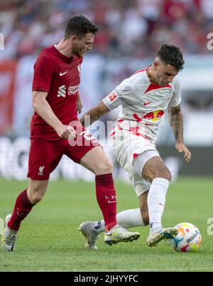 Leipzig, Germany. 21st July, 2022. Soccer: Test matches, RB Leipzig - FC Liverpool at the Red Bull Arena. Leipzig's Dominik Szoboszlai (r) takes the ball from Liverpool's Andrew Robertson. Credit: Hendrik Schmidt/dpa/Alamy Live News Stock Photo