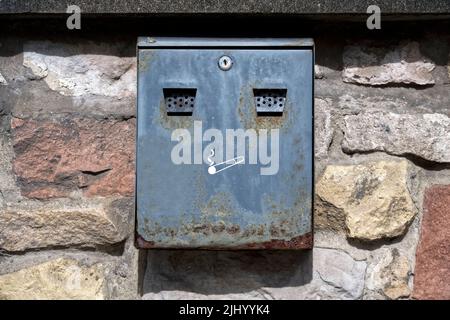 Cigarette smokers steel metal ashtray fitted to wall Stock Photo