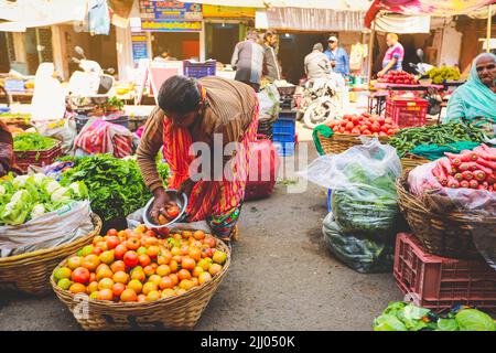 Jaisalmer, India - January 19, 2020 : Selective focus on tomatoes, vegetable market on streets in Jaisalmer. Stock Photo