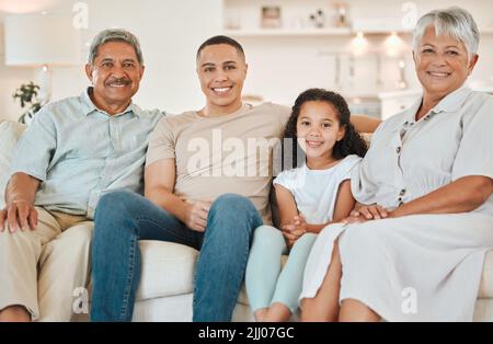 Typical Sundays. a beautiful family bonding on a sofa at home. Stock Photo