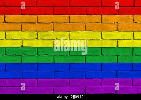 LGBT flag on brick wall background. Flag of LGBT depicting in paint colors on brick wall. Stock Photo